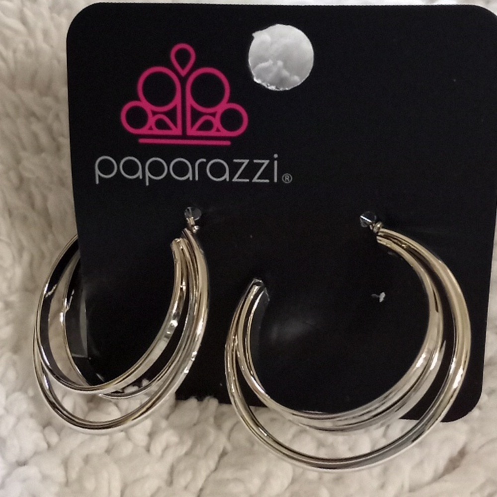 Curvy Charisma Silver 1 inch hoops.